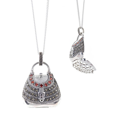 garnet handbag locket in silver on a white background