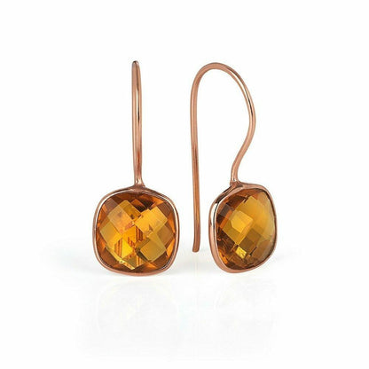 citrine earrings in rose gold on a white background