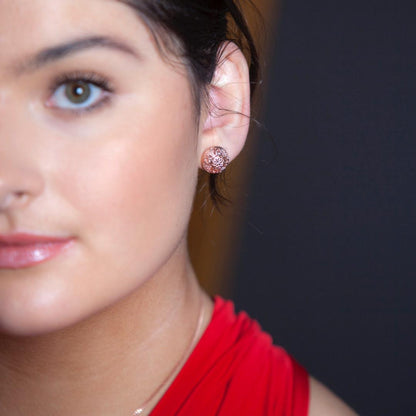 model wearing rose gold memory keeper earrings