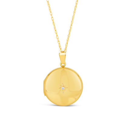 round diamond locket in gold with family photos inside