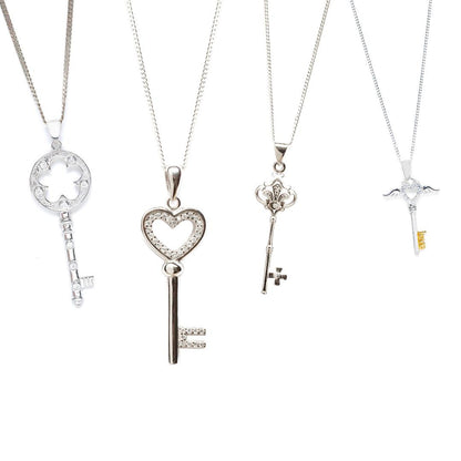 collection of key shaped jewellery on a white background