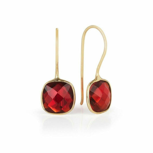 garnet earrings in gold on a white background