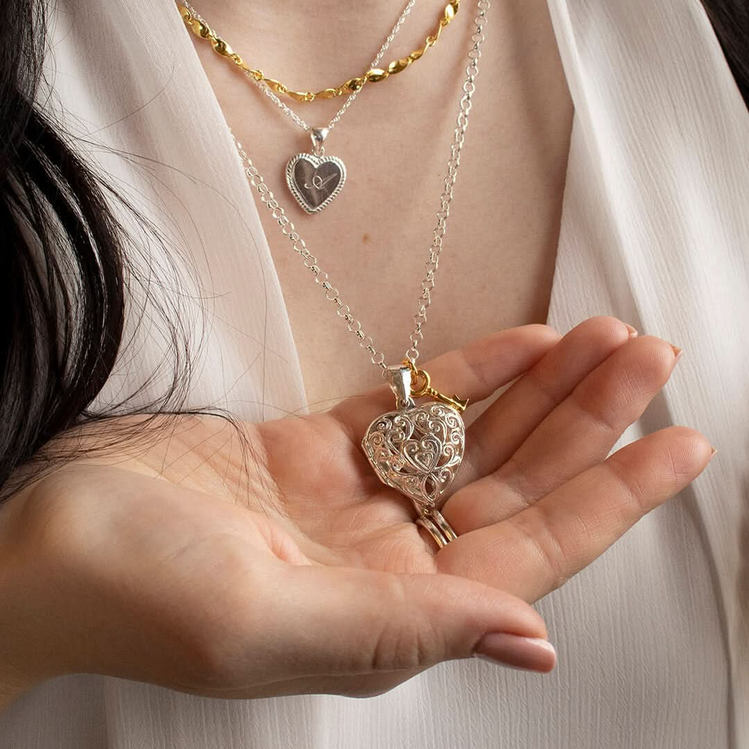 model wearing heart locket in silver 