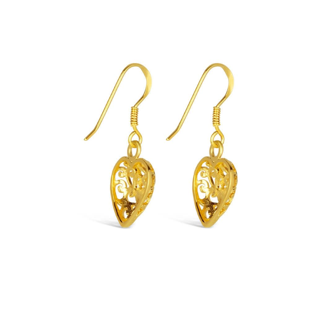 heart earrings in gold on a white background