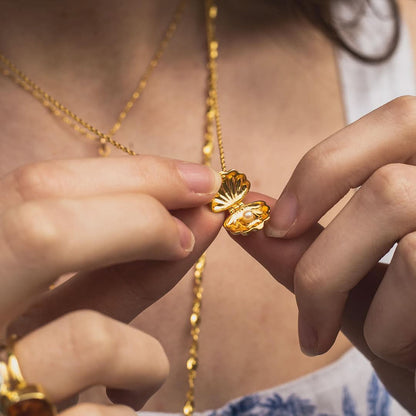 gold charm shell necklace opened by model