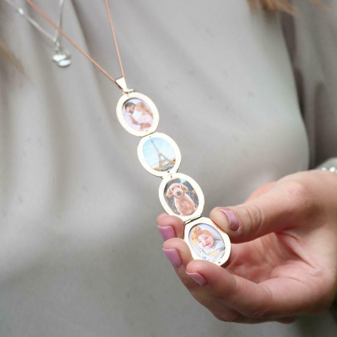 Model holding rose gold oval shaped locket with four photos