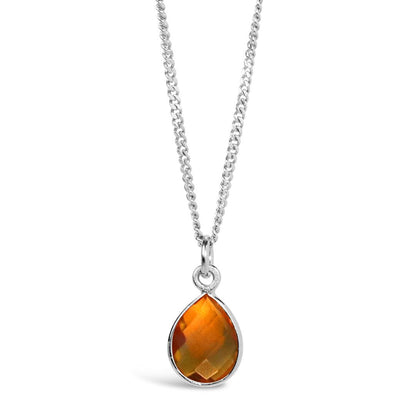 citrine charm necklace in silver on a white background