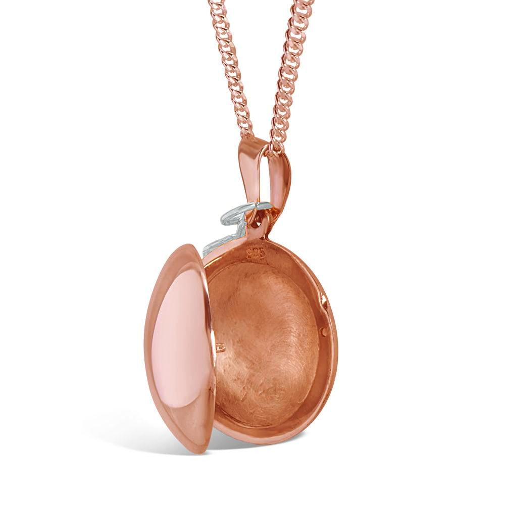 opened rose gold feather locket on a white background