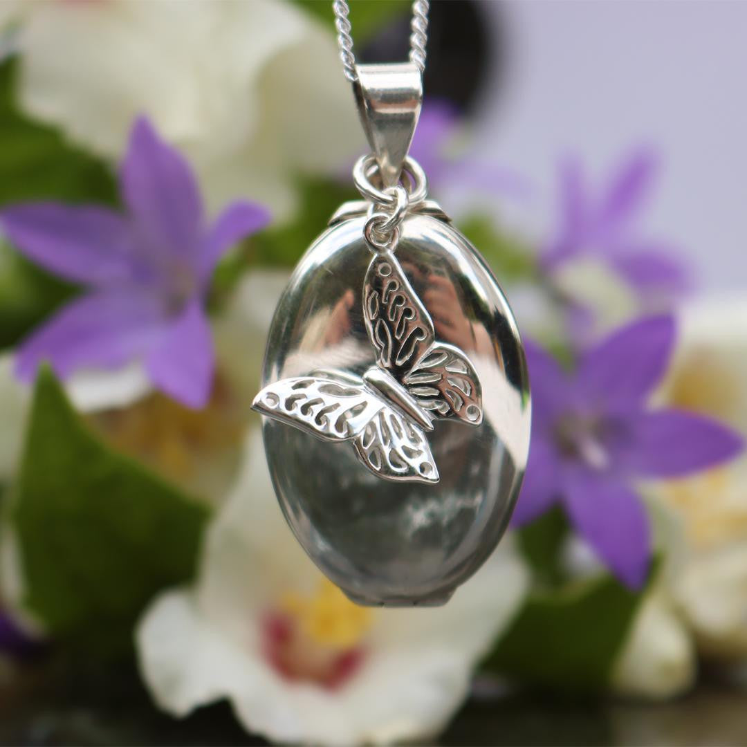 Lily Blanche white gold oval shaped locket with butterfly charm