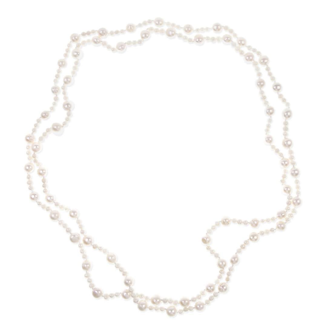 eternal pearl necklace in ivory on a white background