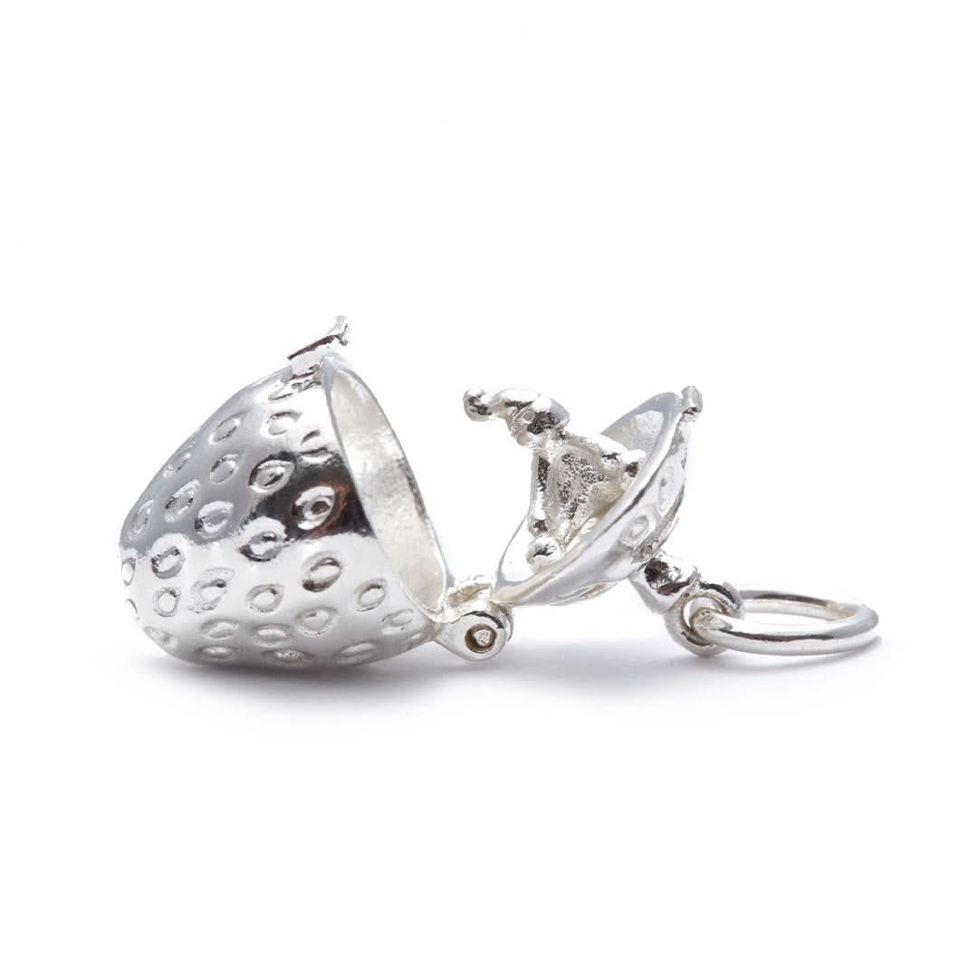 opened magical strawberry charm on a white background