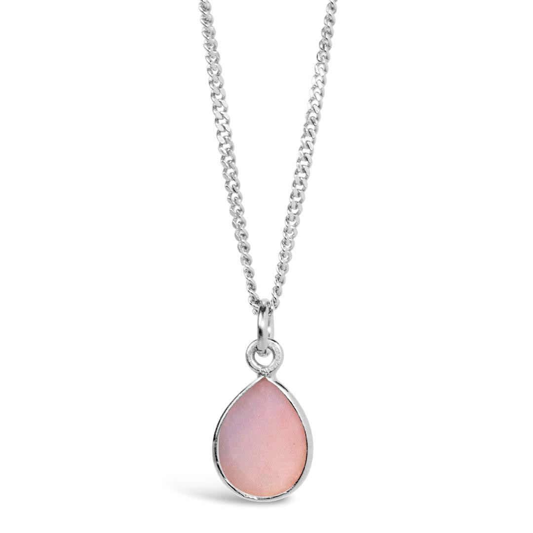 pink opal charm necklace in silver on a white background