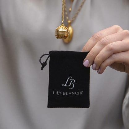 model holding Lily Blanche storage pouch
