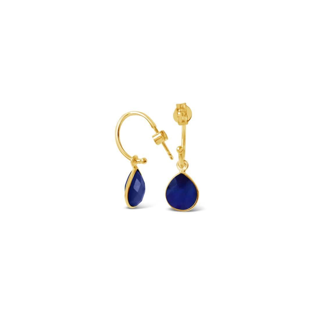 sapphire drop hoop earrings on a white background