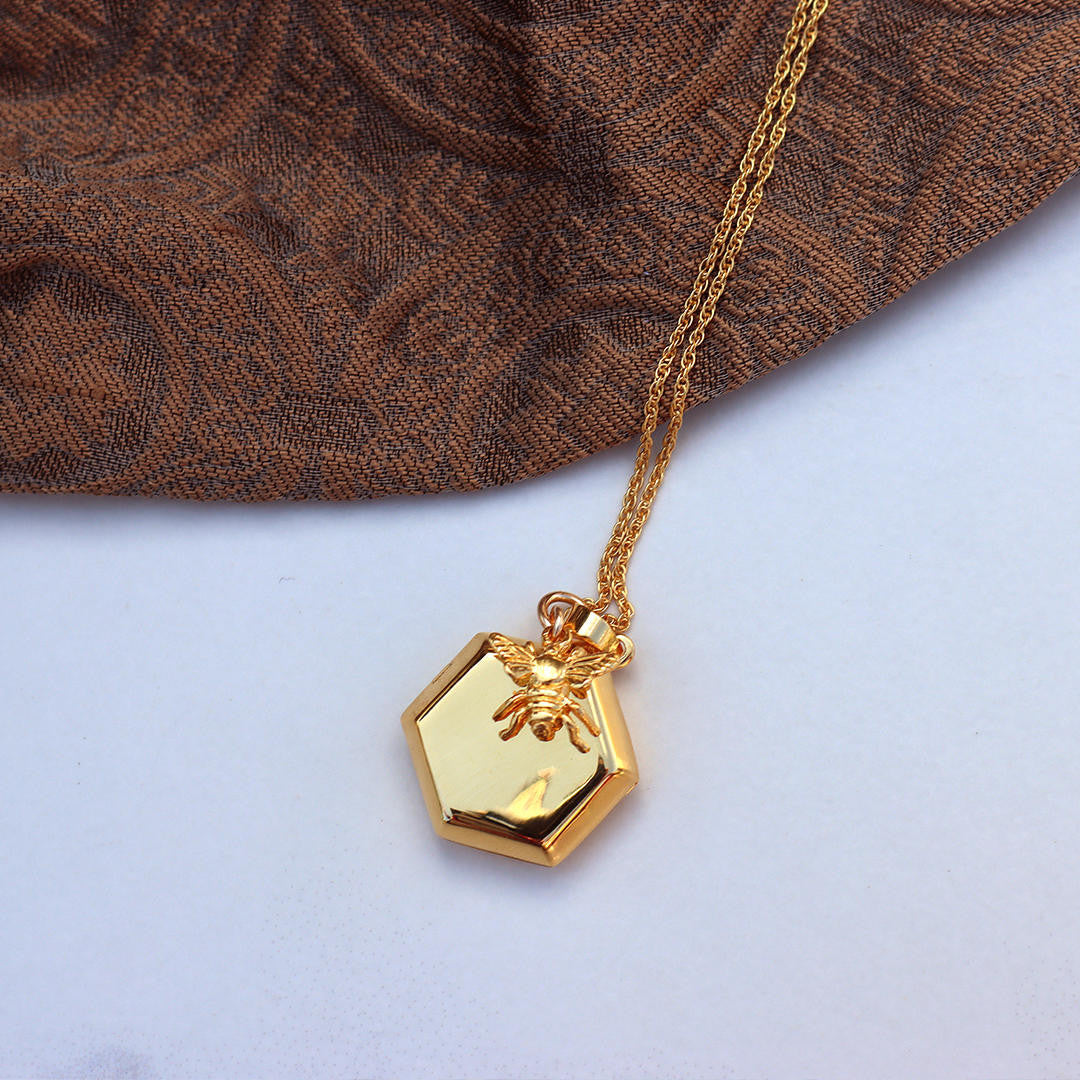 gold rope chain with gold bee locket and gold bee charm