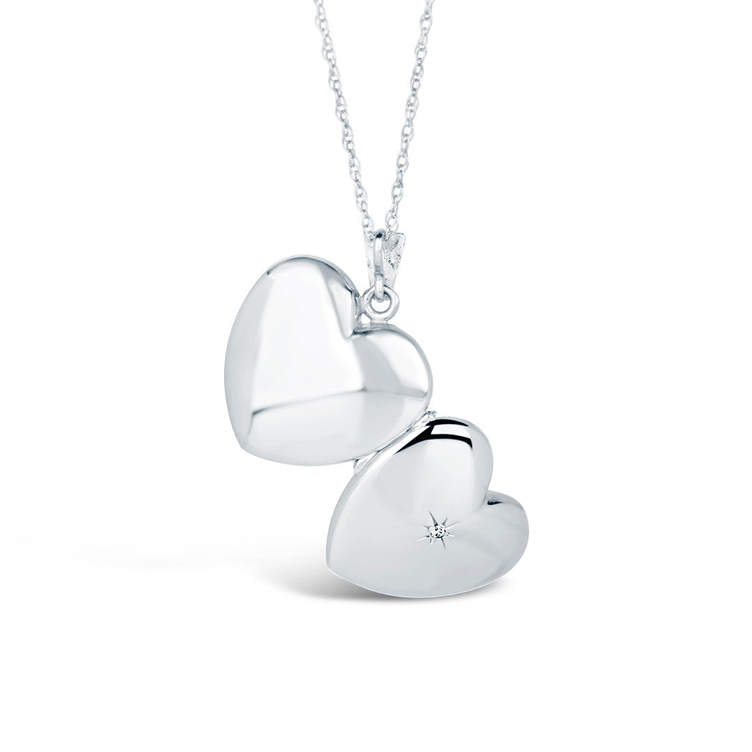 opened diamond heart locket in white gold showing back and front of locket
