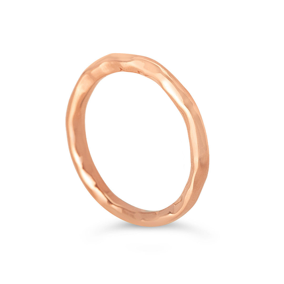 men's hammered rose gold ring on a white background