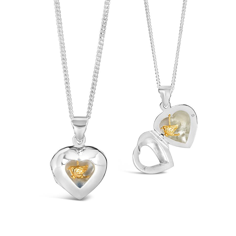 gold song in my heart locket on a white background