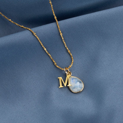 moonstone charm necklace in gold with initial charm