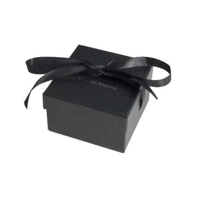 black ribbon-tied Lily Blanche gift box on a white background