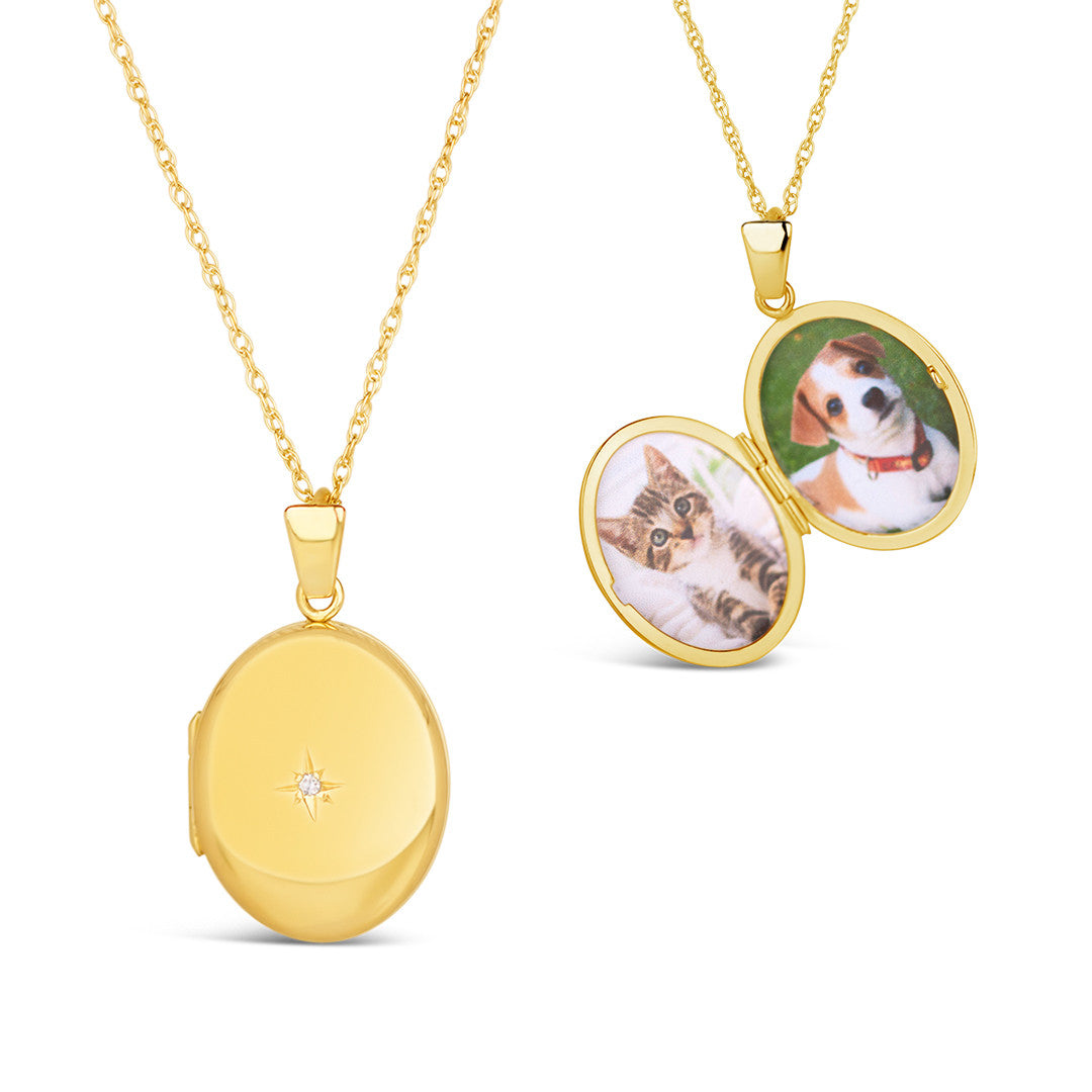 oval diamond locket in gold on a white background