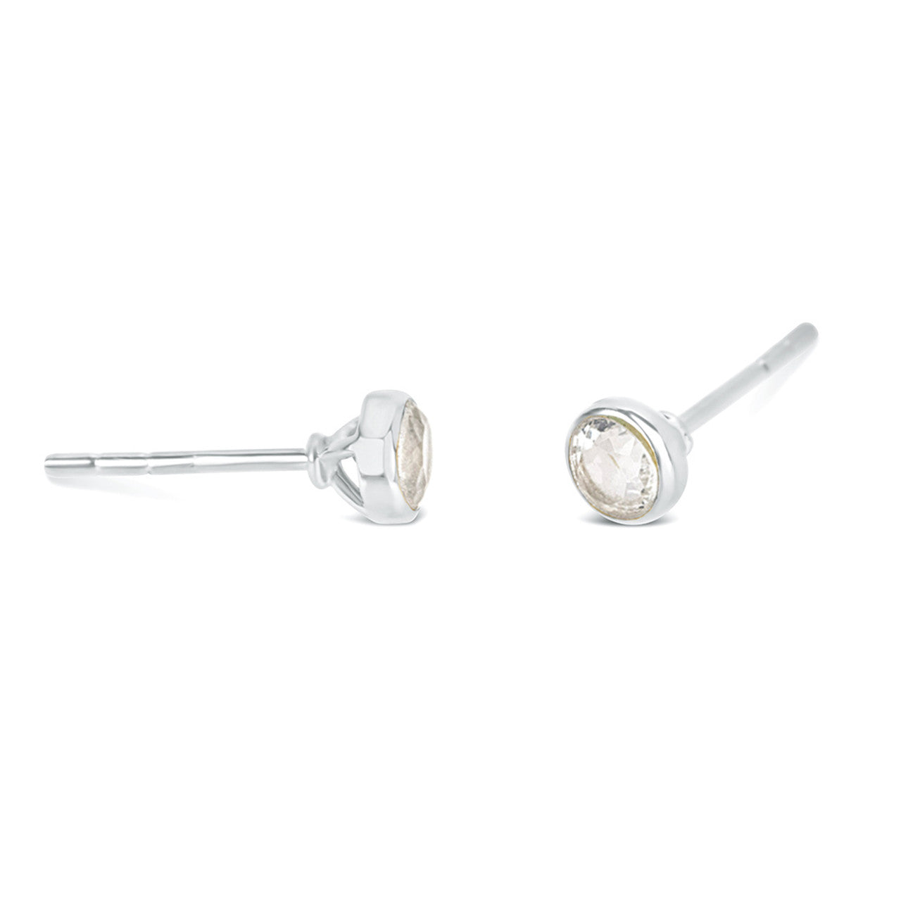 White quartz mini stud earrings in silver facing the side on a white background