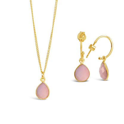 pink opal drop hoop earrings in gold with matching necklace on a white background