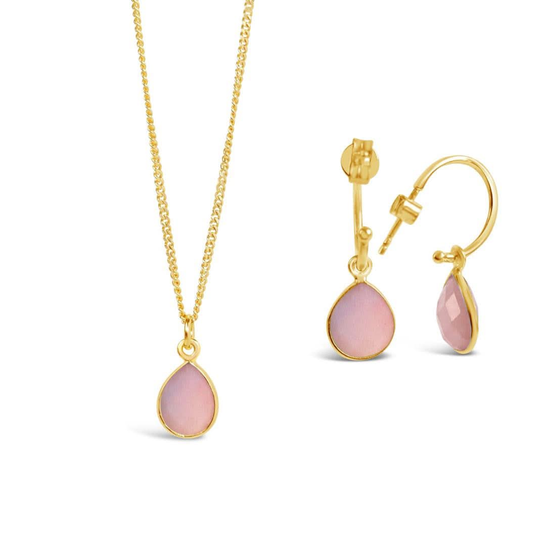 pink opal drop hoop earrings in gold with matching necklace on a white background