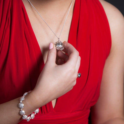 women modelling memory keeper bracelet in silver
