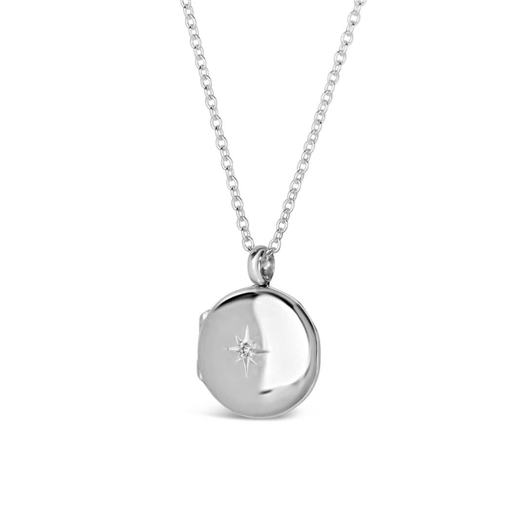 small round diamond locket on a white background