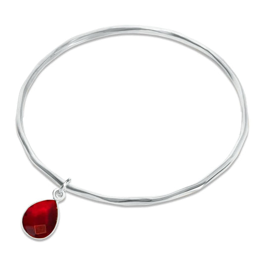 silver garnet charm bangle on white background