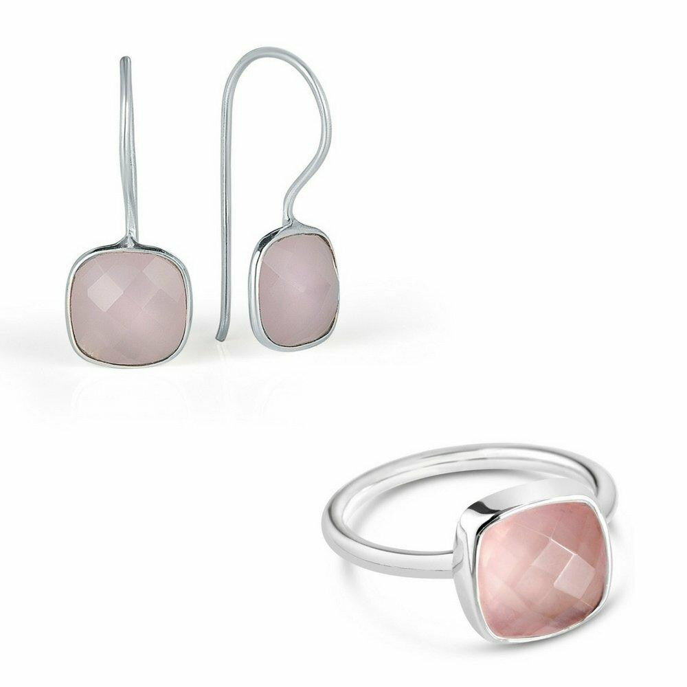 rose quartz earrings and cocktail ring in silver on a white background