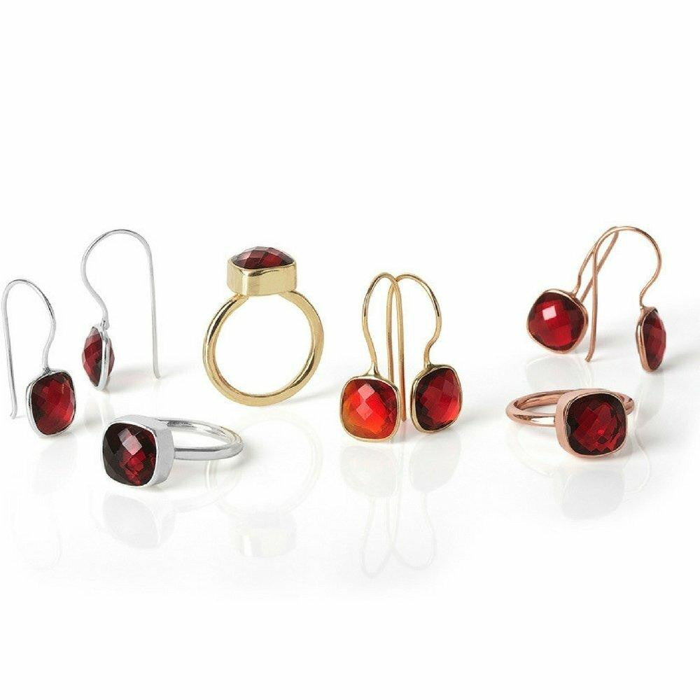garnet jewellery in silver, gold, and rose gold on white background
