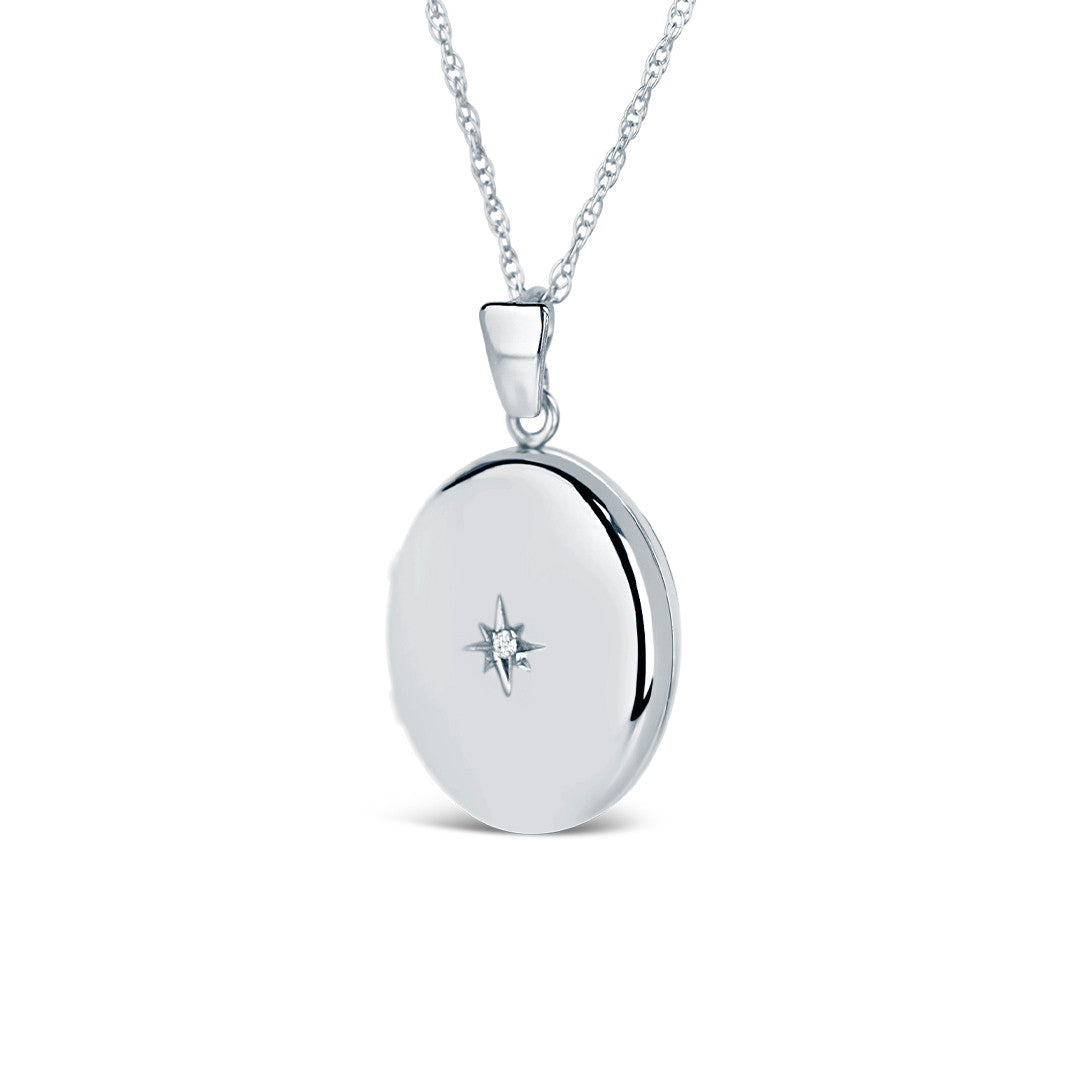 solid white gold diamond oval locket on a white background