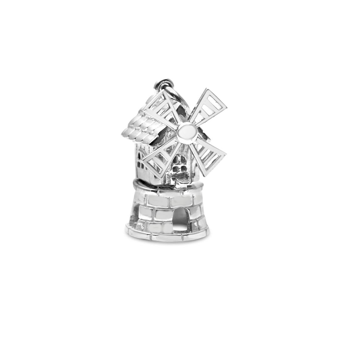 magical windmill charm in silver on a white background