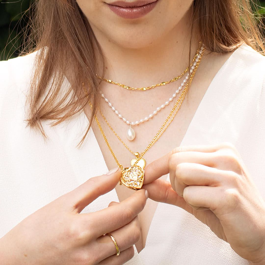 model wearing key locket in gold