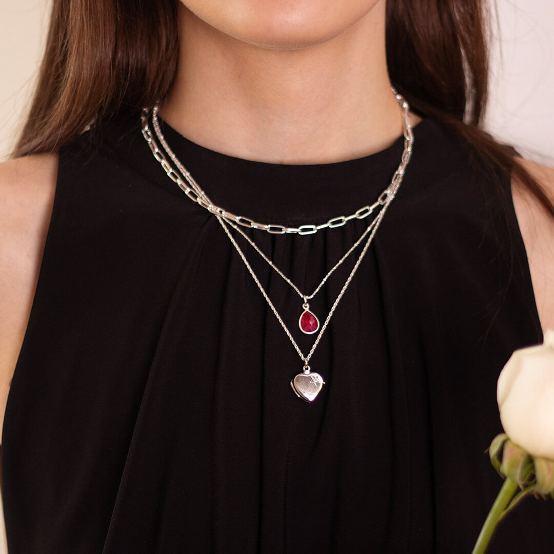 model wearing paperclip chain necklace in silver with other silver jewellery 