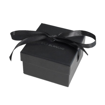 black ribbon-tied lily blanche gift box on a white background