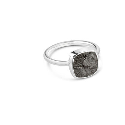 rutilated quartz cocktail ring in silver on a white background