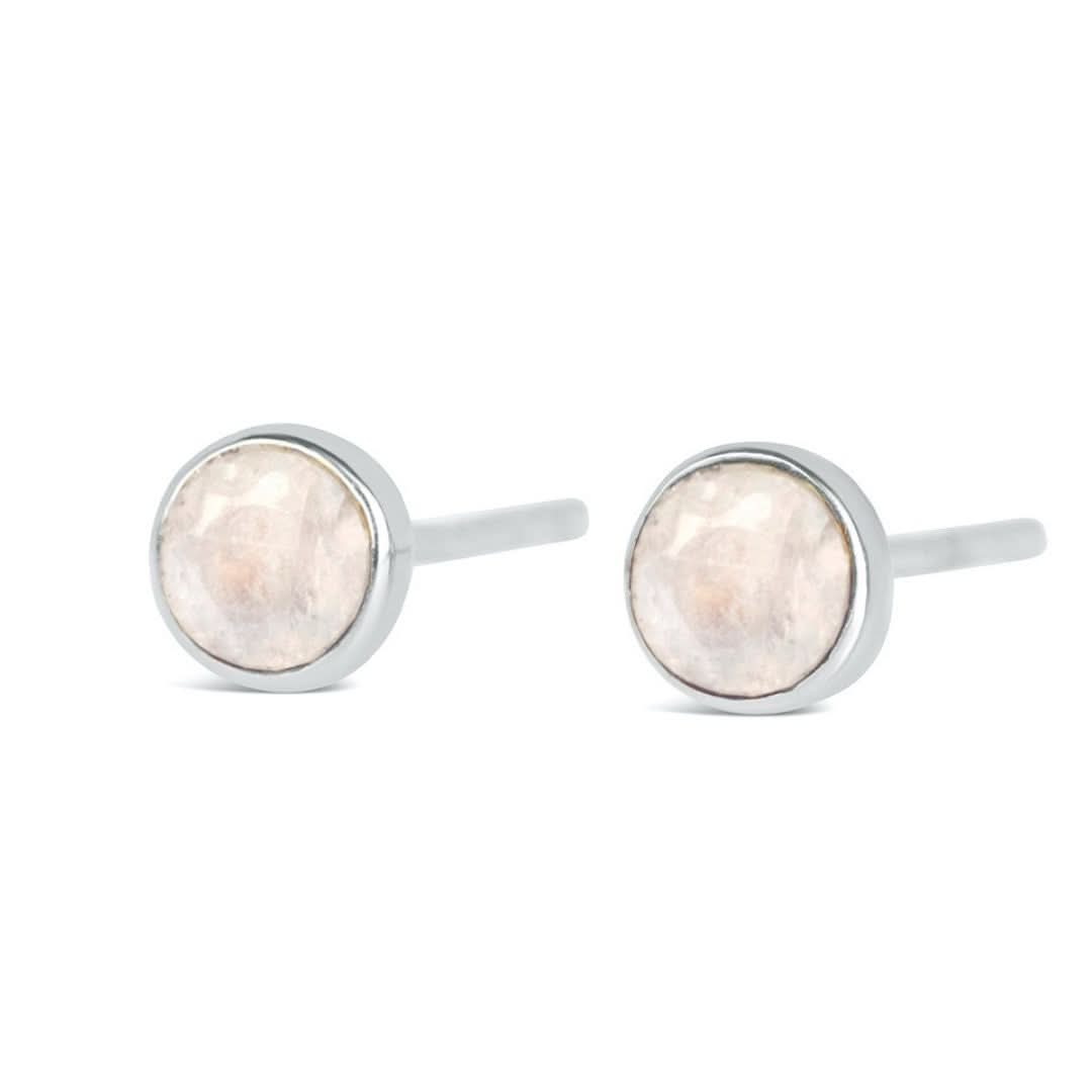 Silver moonstone stud earrings on a white background