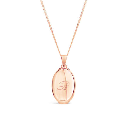 closed four photo butterfly locket in rose gold with the letter R engraved