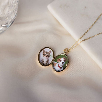 opened diamond oval locket in gold with photos inside on a white background