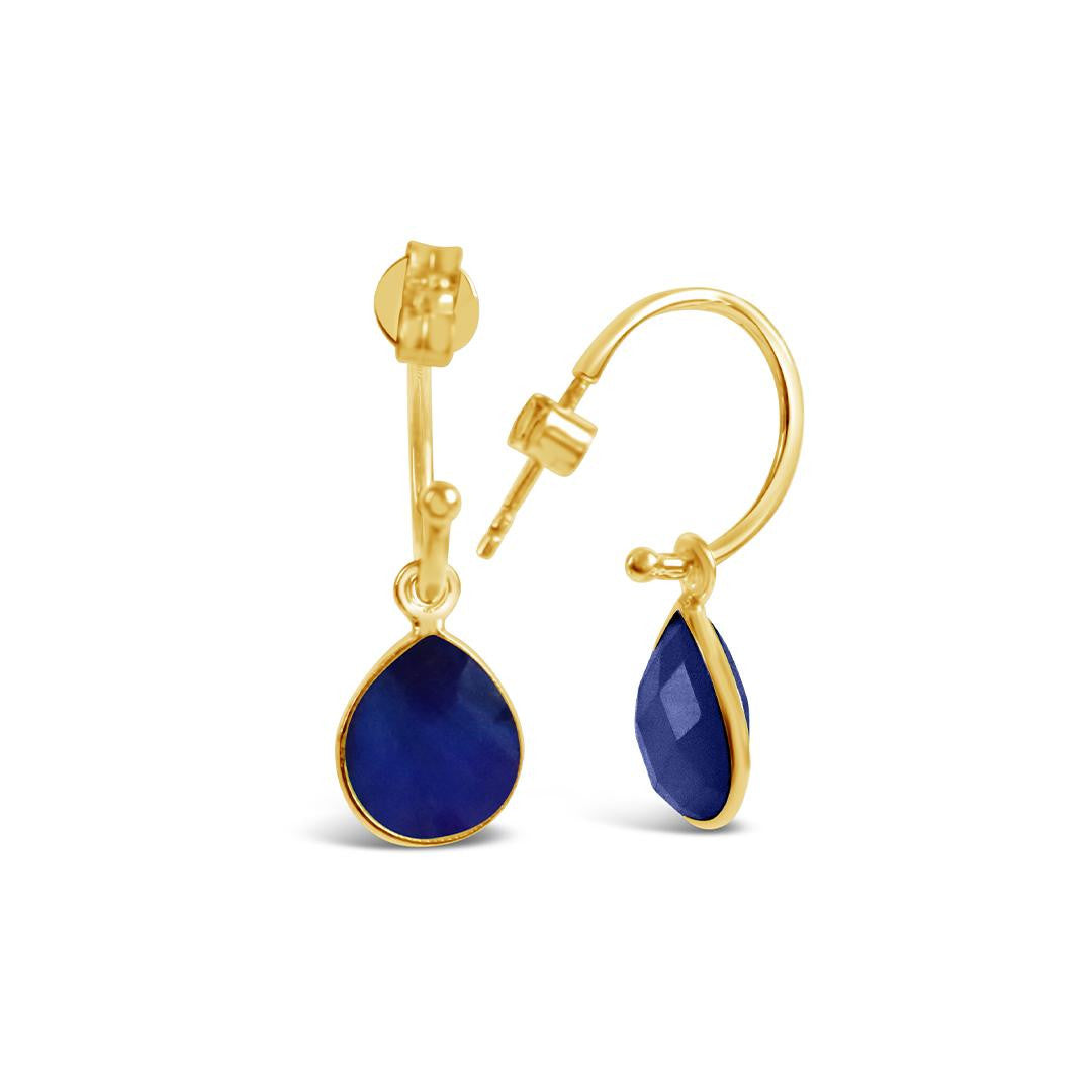 sapphire drop hoop earrings in gold on a white background