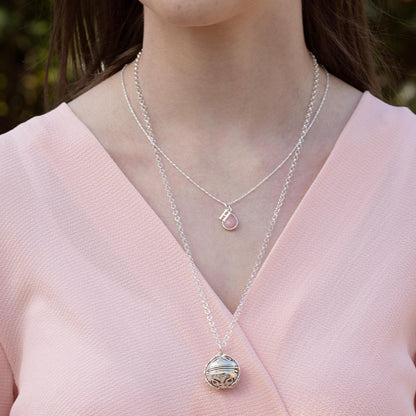 model wearing white gold belcher chain and memory keeper locket