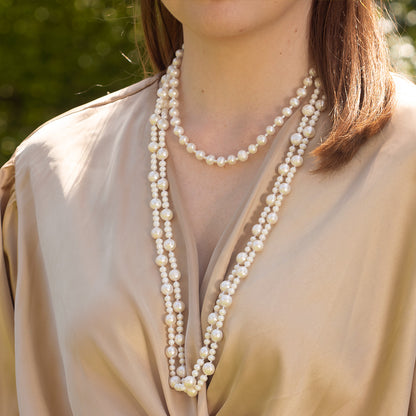model wearing eternal pearl necklace in ivory