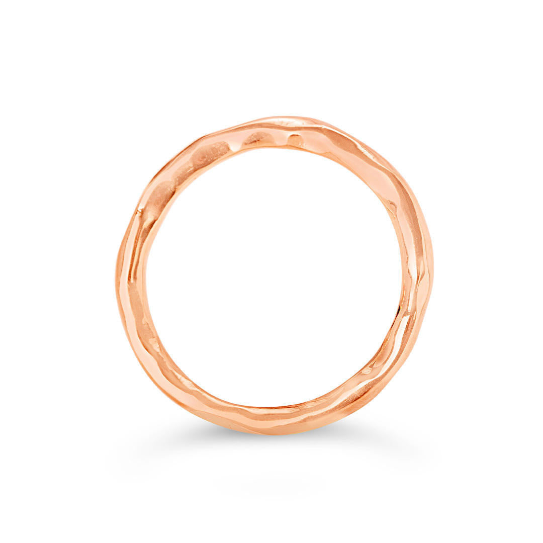 rose gold friendship band ring on a white background