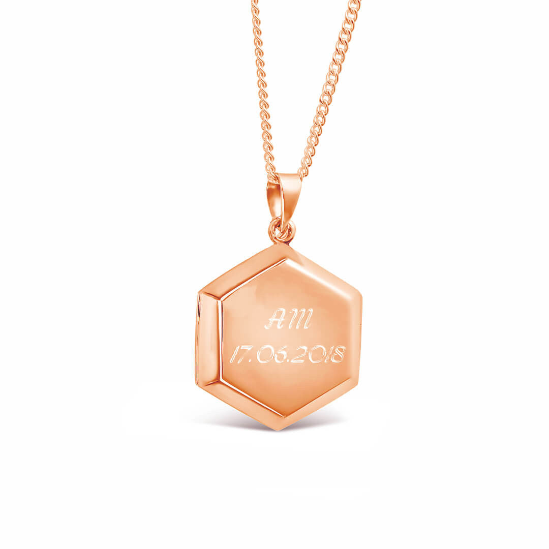 engraved photo locket in rose gold on a white  background