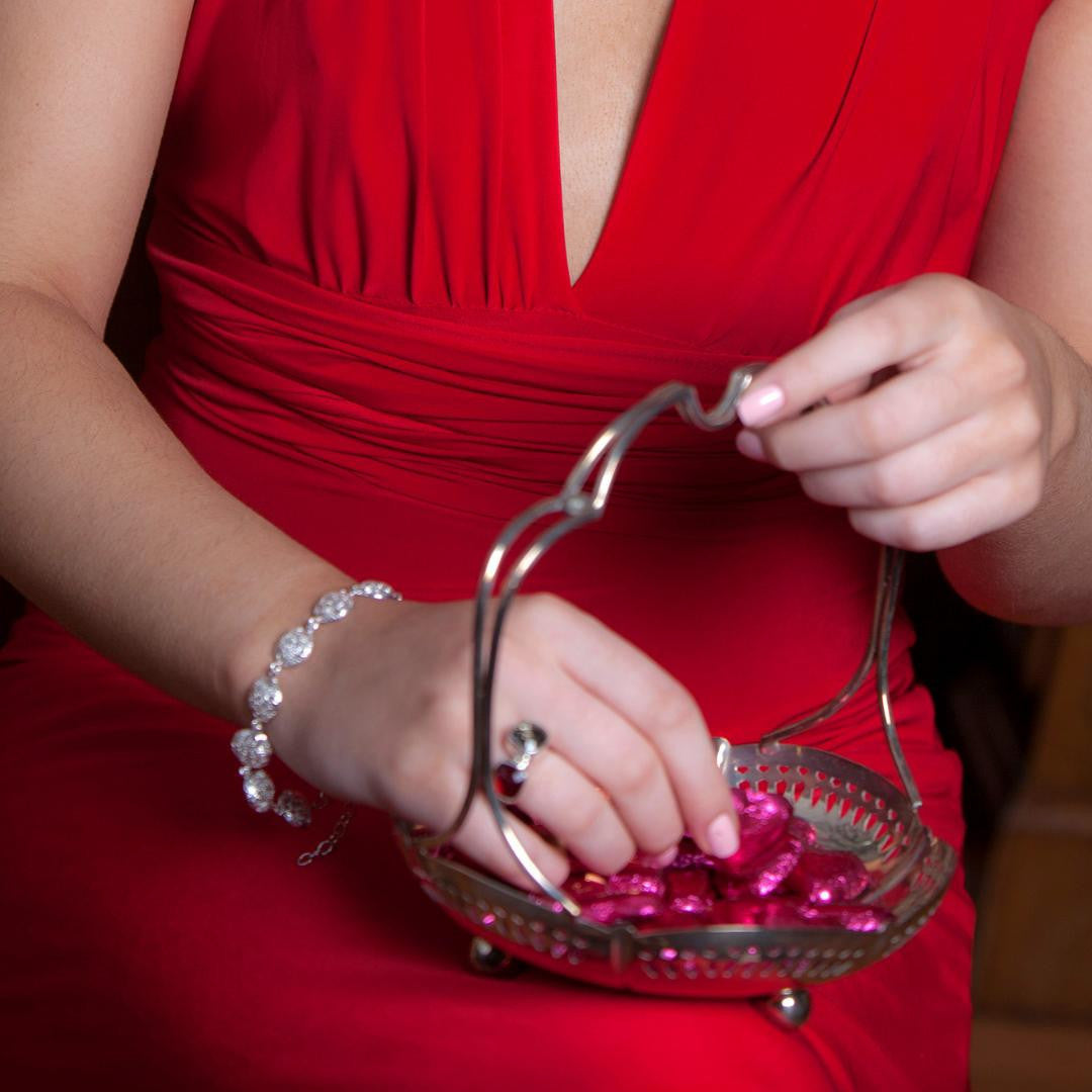 women modelling memory keeper bracelet in white gold