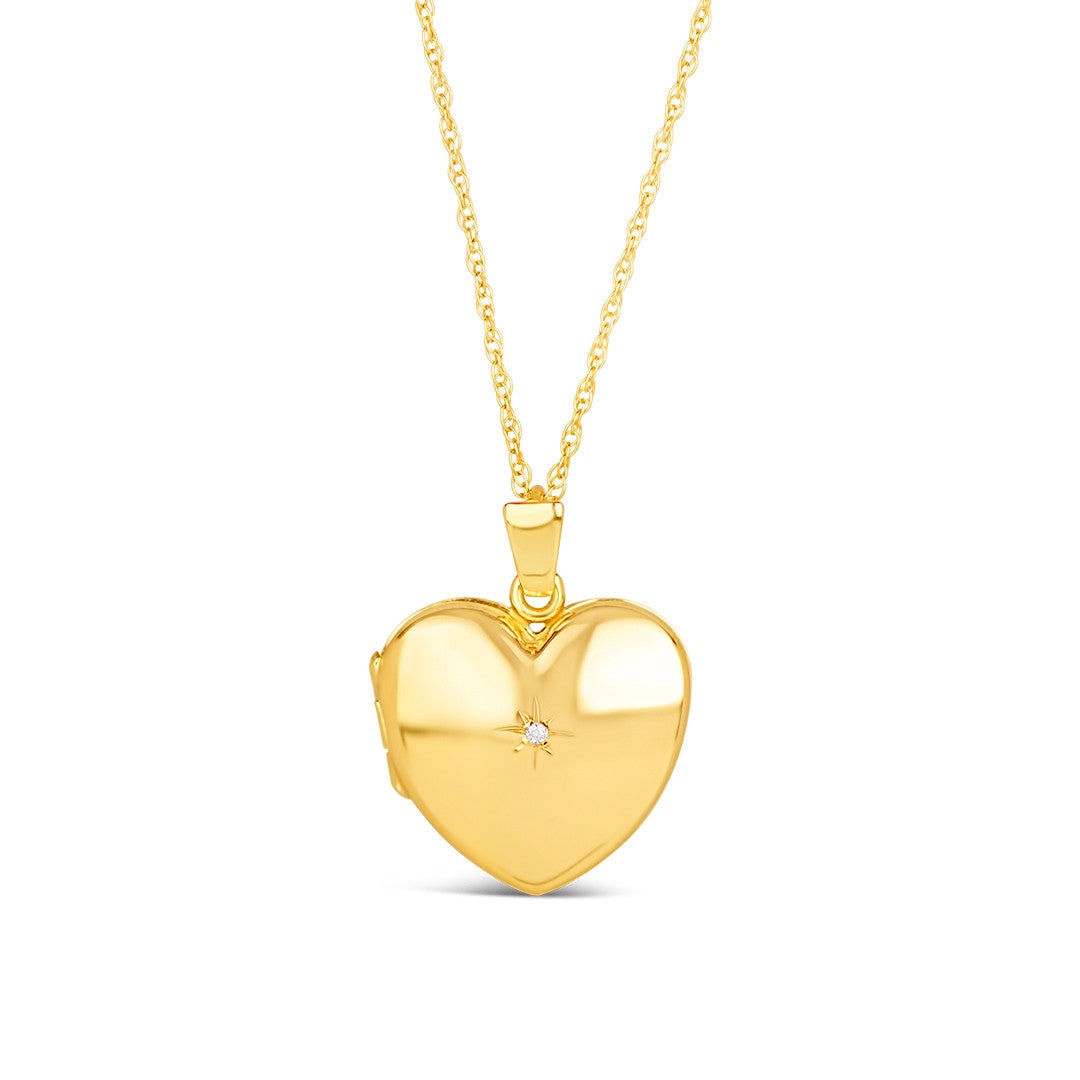 diamond heart locket in gold on a white background