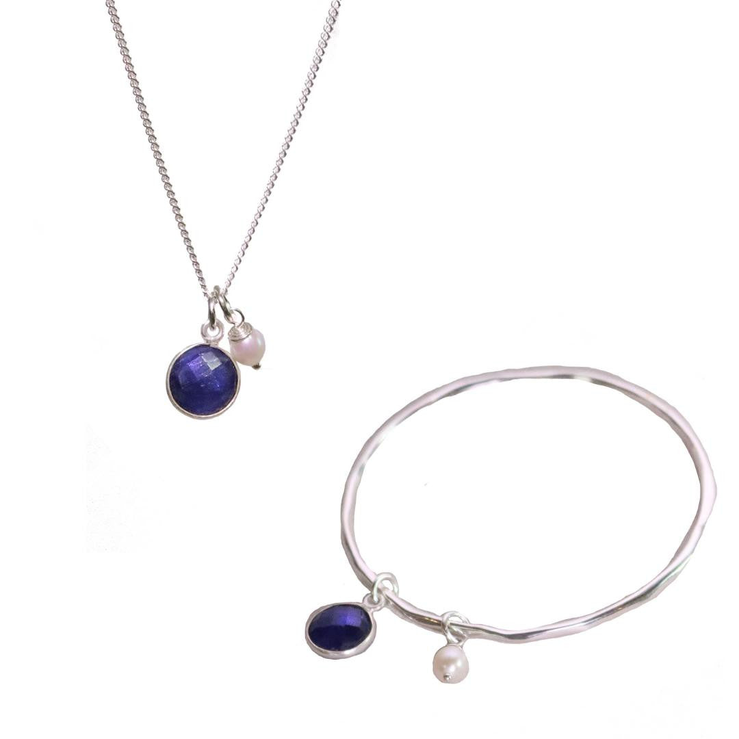 silver sapphire charm bangle and necklace with silver pearl attached 
